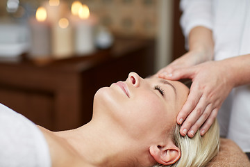 Image showing close up of woman having face massage in spa