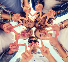 Image showing group of teenagers showing finger five