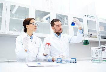 Image showing young scientists making test or research in lab