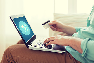 Image showing close up of man with laptop and credit card