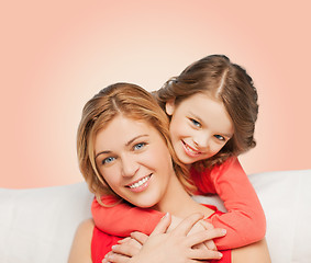 Image showing happy mother with daughter hugging and talking