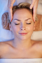 Image showing close up of woman having face massage in spa