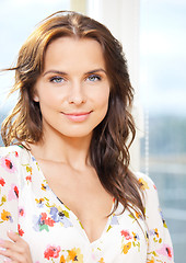 Image showing happy woman at the window