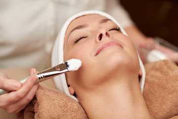 Image showing close up of young woman and cosmetologist in spa