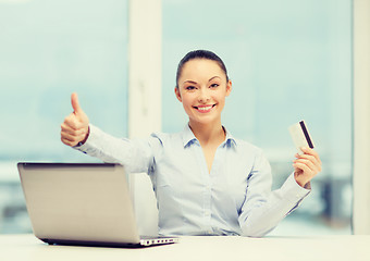 Image showing businesswoman with laptop in office