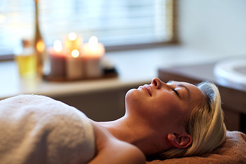 Image showing young woman lying in spa