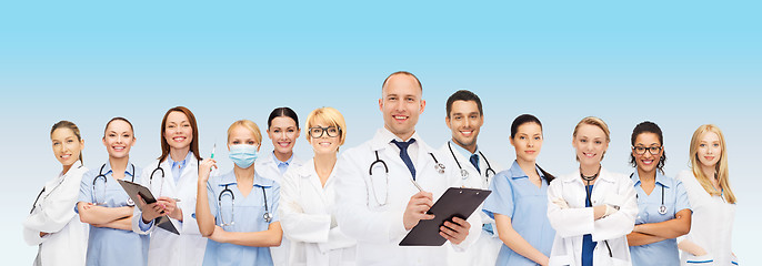 Image showing group of smiling doctors with clipboard