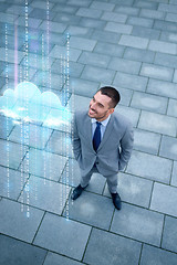 Image showing young smiling businessman outdoors from top