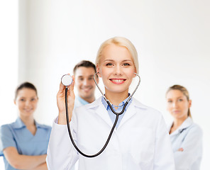 Image showing smiling female doctor with stethoscope