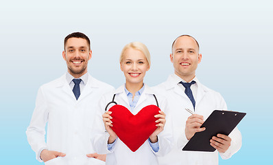 Image showing group of smiling doctors with heart and clipboard