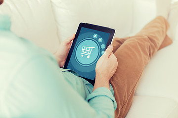 Image showing close up of man with tablet pc computer at home