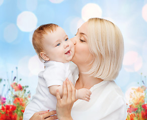 Image showing happy mother with baby over natural background