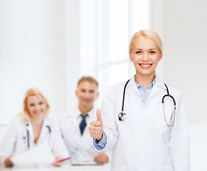 Image showing smiling female doctor showing thumbs up