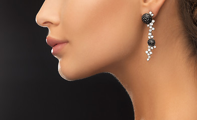 Image showing woman wearing shiny diamond earrings