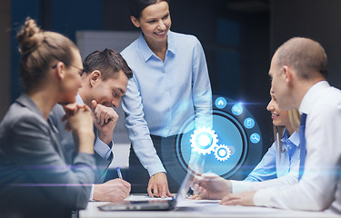 Image showing smiling female boss talking to business team