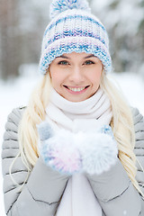 Image showing smiling young woman in winter forest