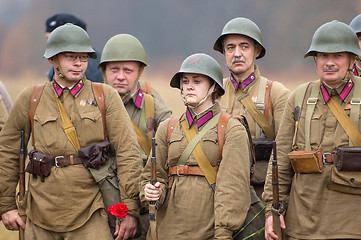 Image showing Soldiers with flowers