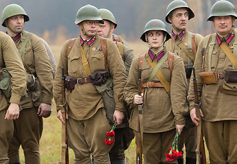 Image showing Soldiers with flowers