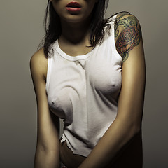 Image showing tattoo girl in wet t-shirt