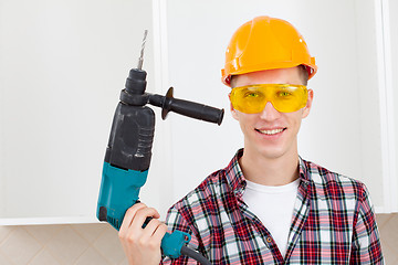 Image showing smiling worker with rock-drill