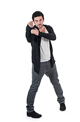 Image showing Angry man gesturing fist raised menacing threat