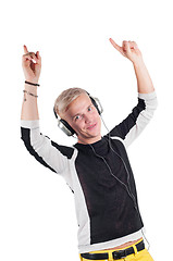 Image showing Young handsome guy dancing with headphones 