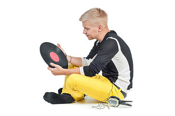 Image showing Guy with headphones and vinyl