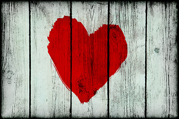 Image showing Red bright abstract heart on old wooden grunge wall