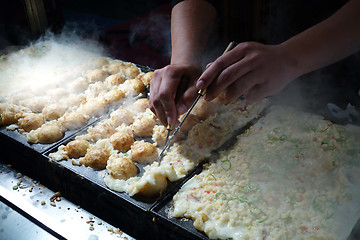 Image showing The making of Takoyaki in Japan