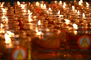 Image showing Burning candles in a temple for worship.