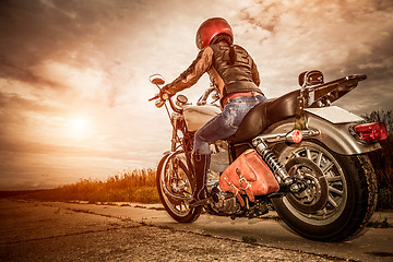 Image showing Biker girl on a motorcycle