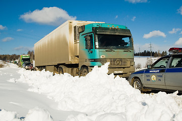 Image showing Trucks stopped on highway after heavy snow storm