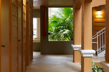 Image showing outside hallway with with doors and rain