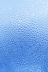 Image showing Natural water drops on glass