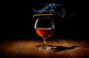 Image showing Cigar on wineglass