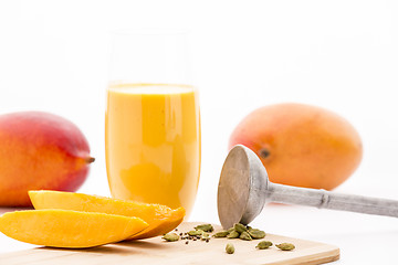 Image showing Mango Flesh, Cardamom, Pestle And Mango Mocktail