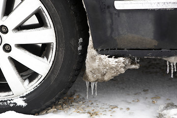 Image showing Frozen ice on car tires 