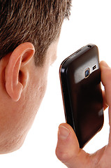 Image showing Man holding cell phone.