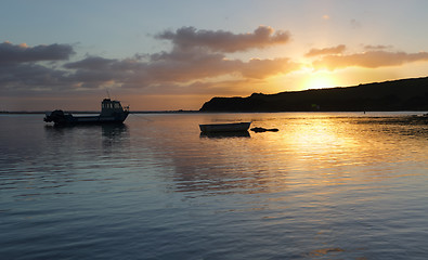 Image showing Boats on the water at sunrise