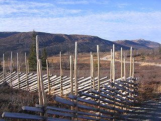 Image showing Traditional Norwegian fence (skigard) with mountains in the background