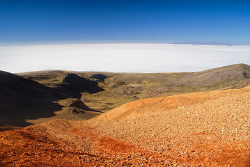 Image showing Salar de Uyuni from colored mountains