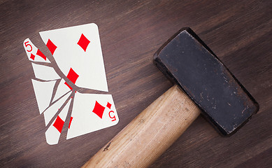 Image showing Hammer with a broken card, five of diamonds