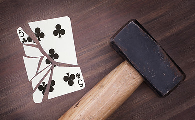 Image showing Hammer with a broken card, five of clubs