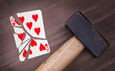 Image showing Hammer with a broken card, eight of hearts