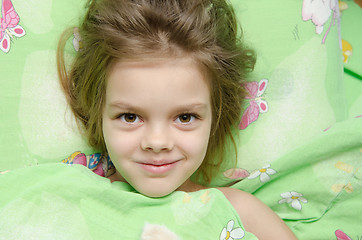 Image showing Girl lying in bed