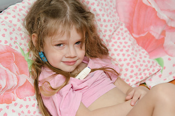 Image showing Diseased three year old girl will measure the temperature