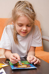 Image showing Five year old girl making sand applique