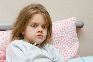 Image showing Six year old girl in bed temperature of 