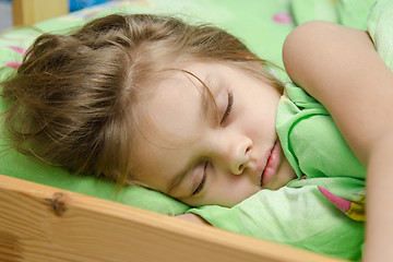 Image showing Portrait of young girl sleeping in bed