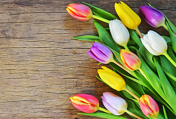 Image showing bouquet of colorful tulips over rustic wooden